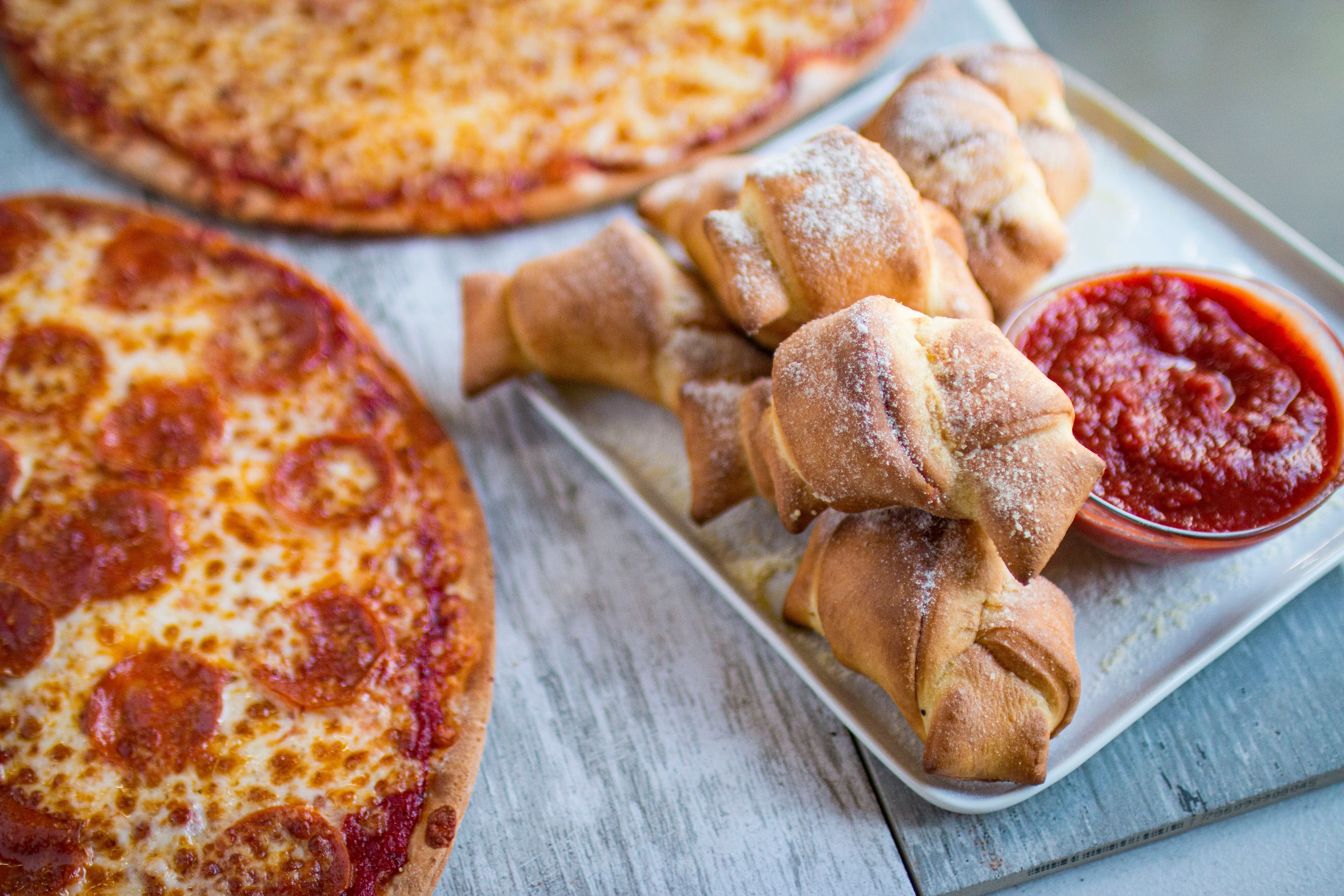 A table of Fresh Brothers pizzas set out for a party